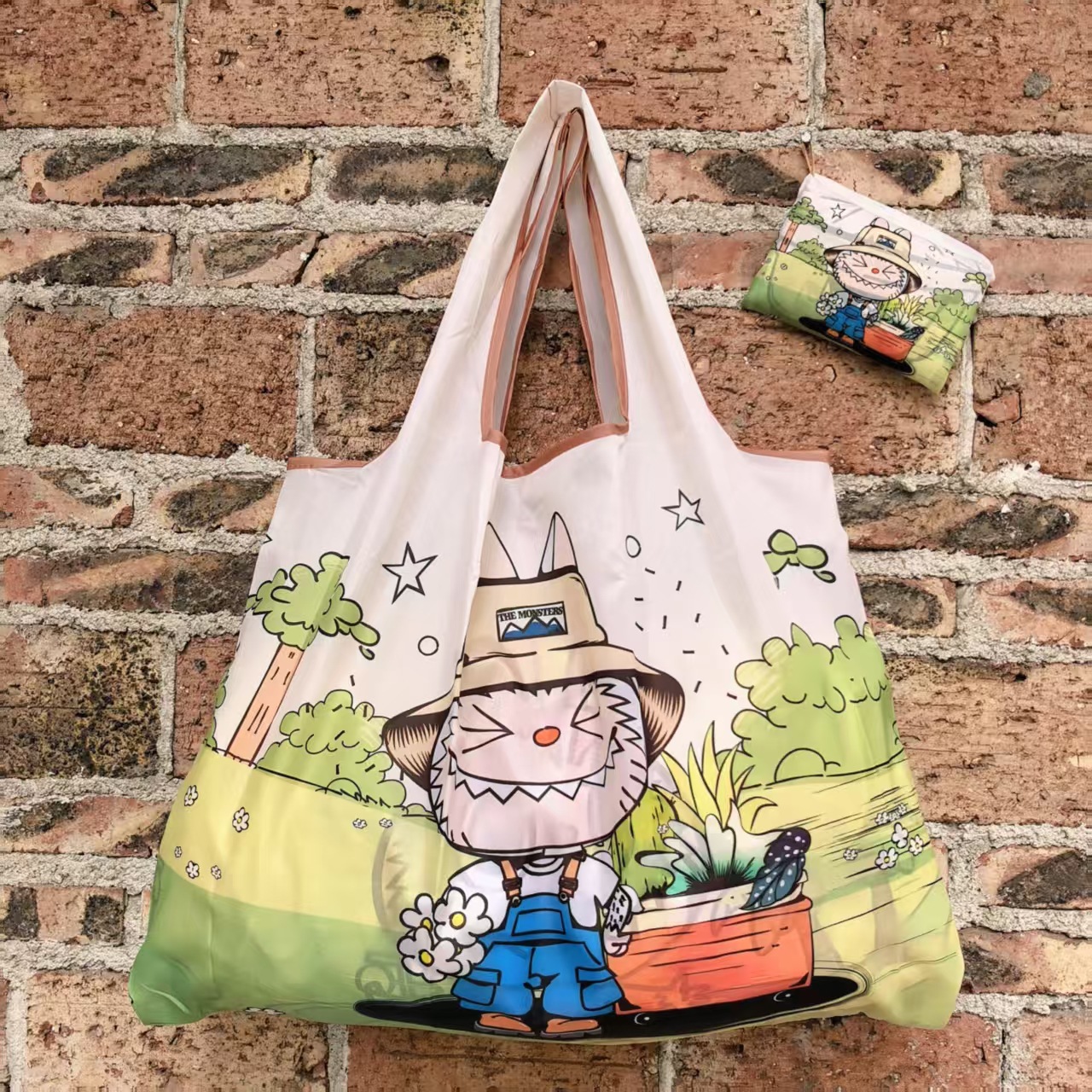 大型アニメスポット折り畳み環境保護レジ袋携帯袋が軽くて、野菜バッグを買って収納するファッションを繰り返している