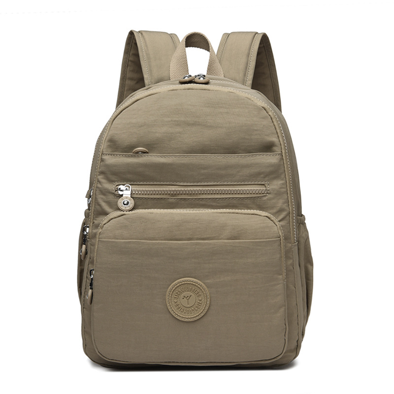 Mochila de hombro de comercio exterior 2025, nueva mochila de computadora simple de color sólido, mochila de escuela secundaria, mochila para hombres y mujeres.