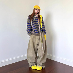 アメリカのレトロなカーキ色の曲がり角のズボンの男女の街頭の高級感のリラックスしています。