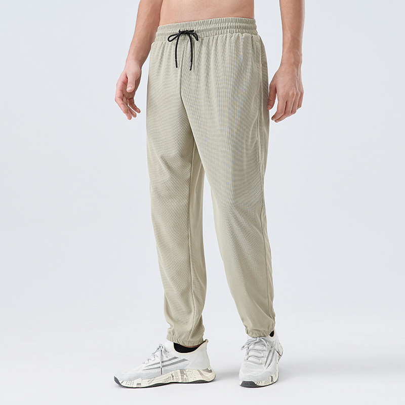 Pantalones deportivos de tejido para hombres respirantes absorbientes de humedad secado rápido entrenamiento de maratón de atletismo para correr pantalones casuales