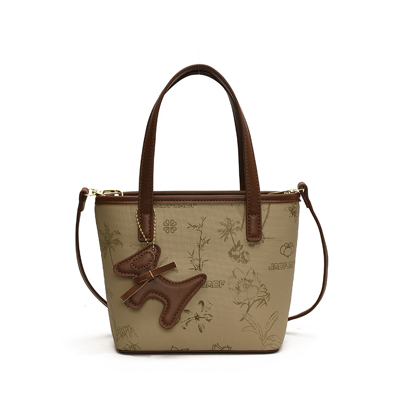 Bolso de mano caliente de tendencia universal para mujeres 2025 nuevo popular bolso de hombro explosivo sensación alta bolso de cubo coreano