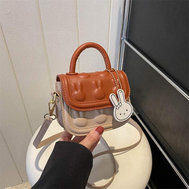 Bolsos para niños, bolsos de mochila encantadores, bolsos de moda de dibujos animados, bolsos de montar de mano, bolsos de cambio para bebés de niñas