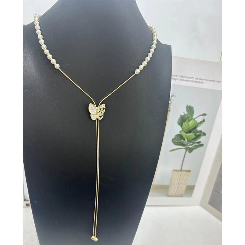 Collier de perles à tirer pour femme, chaîne ras du cou à pompon papillon haut de gamme et polyvalente, chaîne tendance unique pour pull_voghion.com