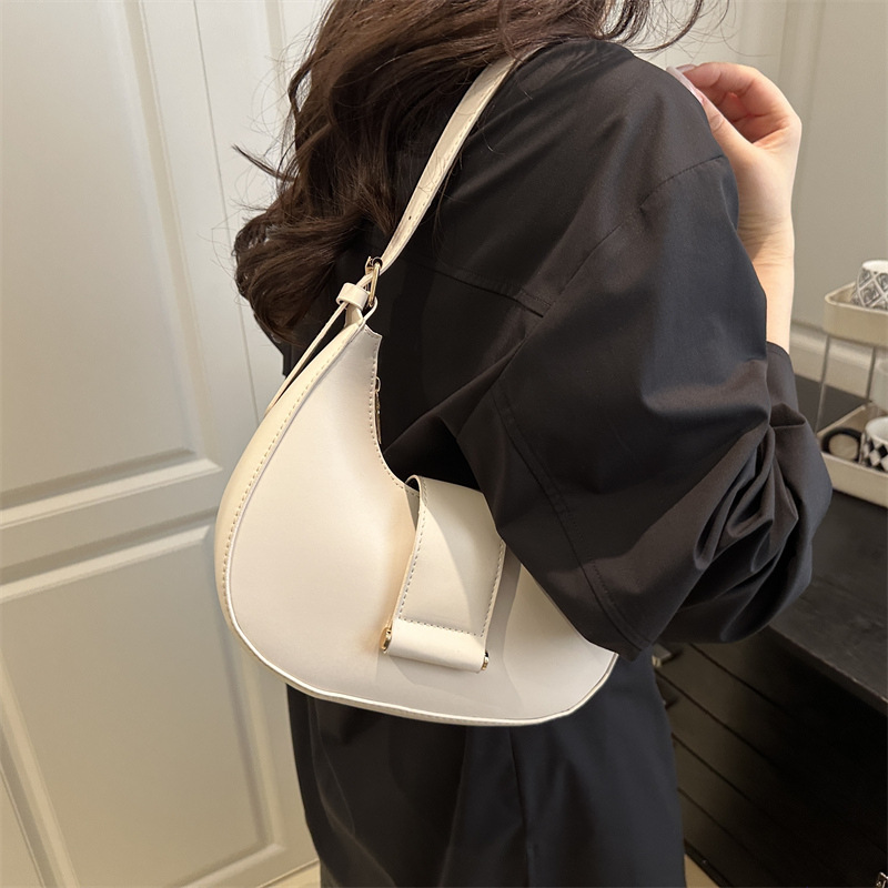 Bolso popular de este año para mujeres 2025, nueva moda de un solo hombro, bolso de diseño de nicho, bolso de media luna debajo de la axila