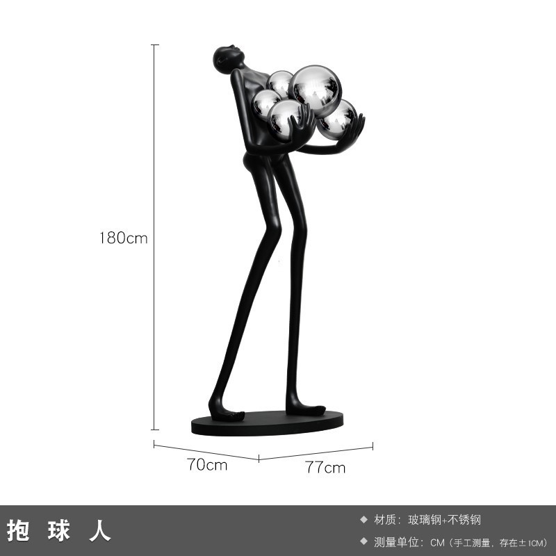 現代の抽象芸術はボールの人物の彫刻を抱きます。|undefined