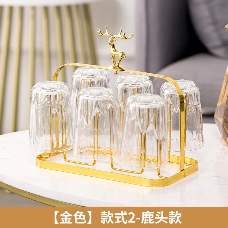 A creative minimalist lightweight luxury water glass rack with drainage, glass water glass stand, stylish design, and an elegant silicone cover