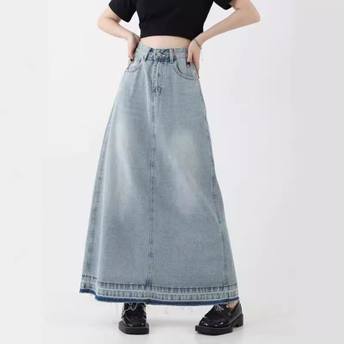 Vintage American design flared denim skirt for women, mini length, featuring frayed edges, high-waisted for a slimming effect, A-line style, suitable for spring.