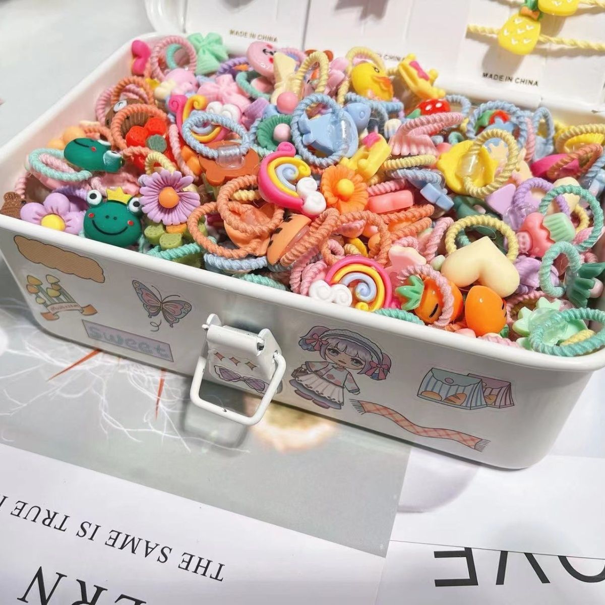 Pequeña niña pulgar anillo de pelo 2024 nueva mini flor dibujos animados no dañar cabello pequeño cabello de color dopamina adornos de cabello