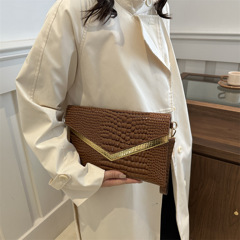 Bolso de mano sobre 2024 otoño nuevo estilo personalidad coreana moda femenina de moda temperamento casual todo-fósforo banquete pequeño bolso