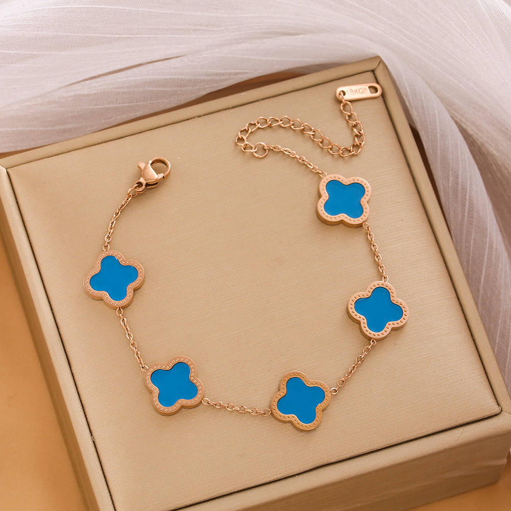 Pulsera de trébol de acero titanium vendedora caliente transfronteriza europea y americana con incrustaciones de concha pulsera colgante pulsera de diseño avanzado sin desvanecimiento al por mayor