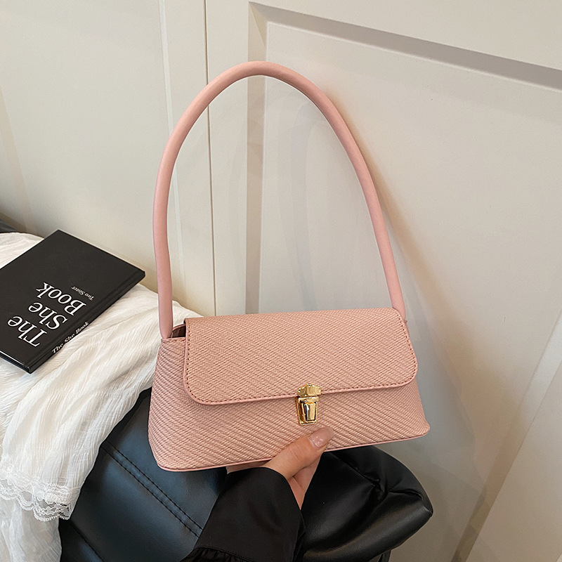 Bolsos de diseño de nicho de ocio para mujer 2025 nuevo bolso de axila de un solo hombro de moda de primavera bolso de palo de mano de moda