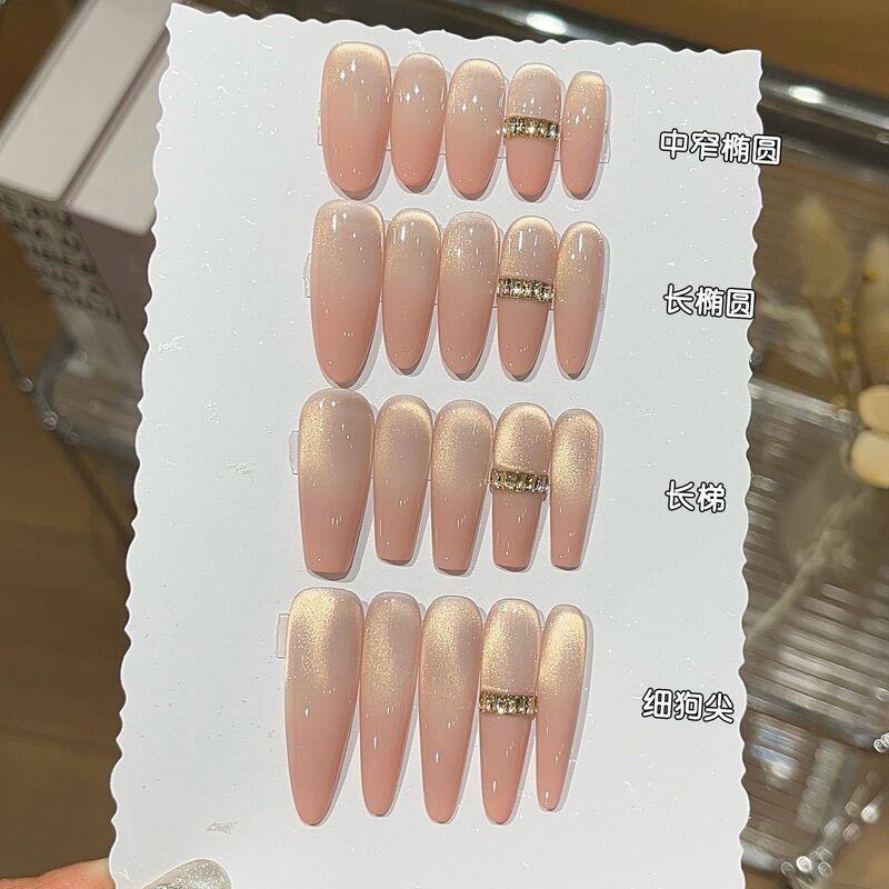 A Gentle Peach Pink Gradient Glittering Gold Cat-Eye Nail Art with Rhinestones That Enhances Complexion, Wearable Nails A Gentle Peach Pink Gradient Glittering Gold Cat-Eye Nail Art with Rhinestones That Enhances Complexion, Wearable Nails