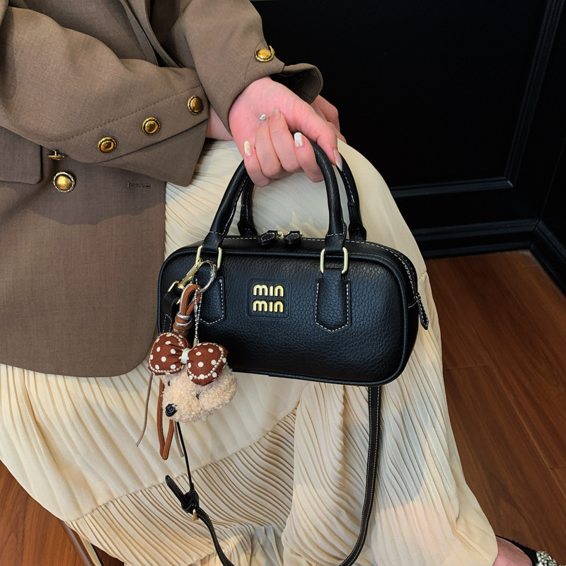 Bolsa de bolos portátil retro para mujeres 2026 nueva moda diaria sensación de bolso cuadrado bolso de hombro universal