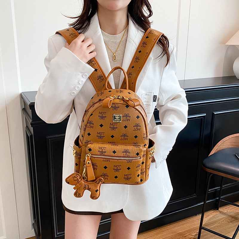 Mochila de moda coreana impresa para mujeres, mochila de clase para estudiantes universitarios, adornos colgantes, mochila de viaje de gran capacidad para mujeres