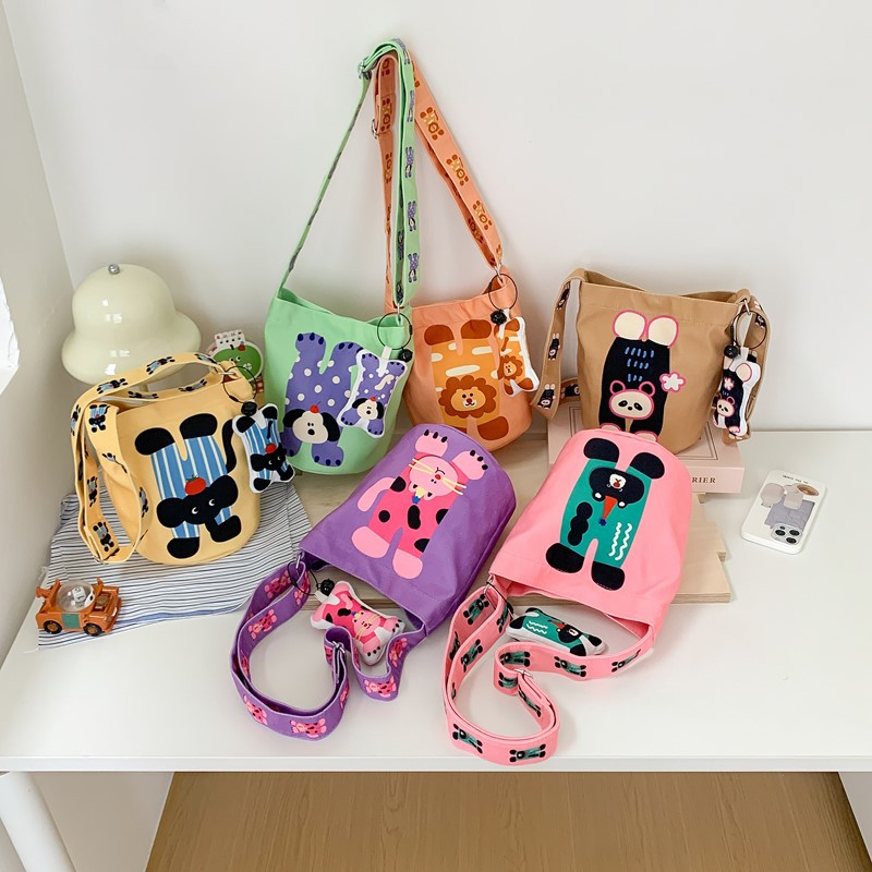 Caricatura encantadora bolsa de hombro de dos lados para niños y niñas, bolsas de cubo de agua para bebés, bolsas de cambio para niños de comercio exterior