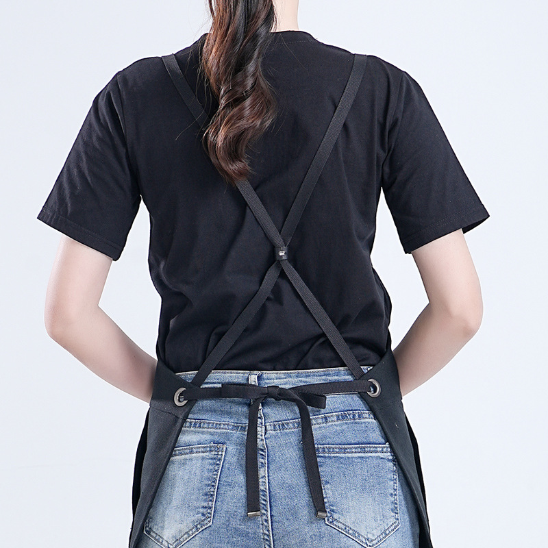 Amazon delantal de lona grueso logo personalizado sin mangas color negro sólido anti-contaminante anti-escaldado pelo delantal de ropa de trabajo