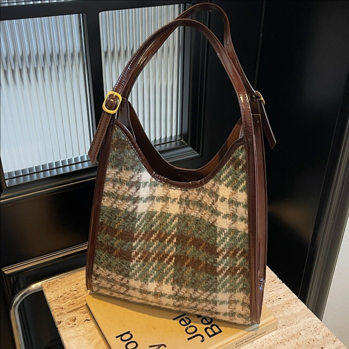 Otoño y invierno coreano tela a cuadros bolso de hombro para mujeres 2025 nuevo estilo retro bolso de cubo portátil bolso de brazo universal