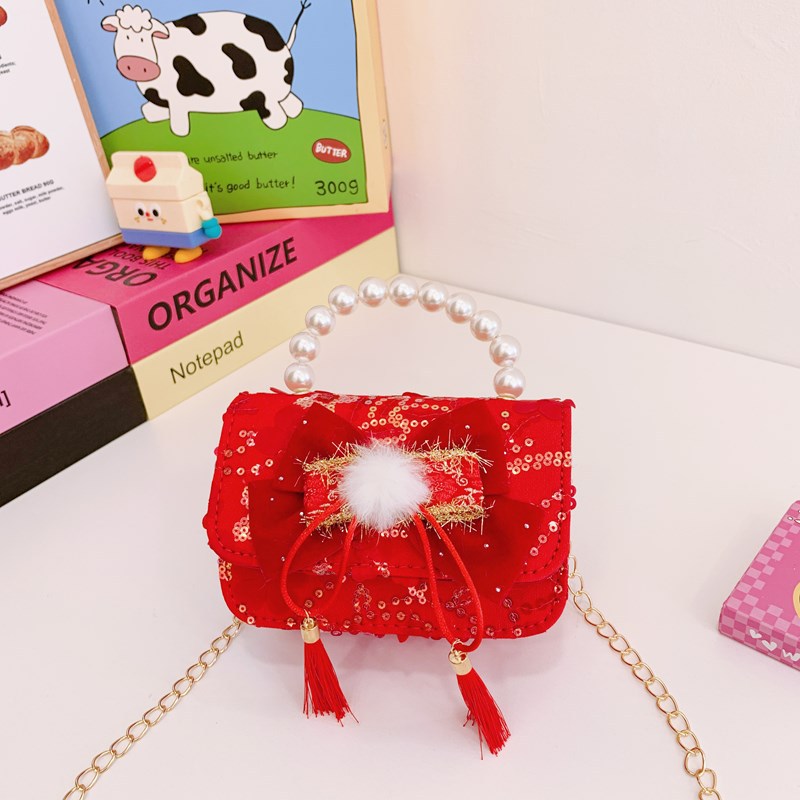 Nuevo bolso de hombro de niñas lindo arco bolso de perla bebé 2025 bolso rojo pequeño viento perfumado bolso para niños