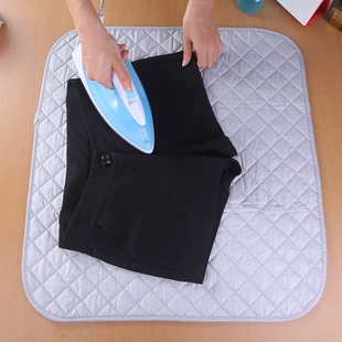 Portable foldable ironing pad, cotton-coated silver backing, replaces ironing board, multiple sizes