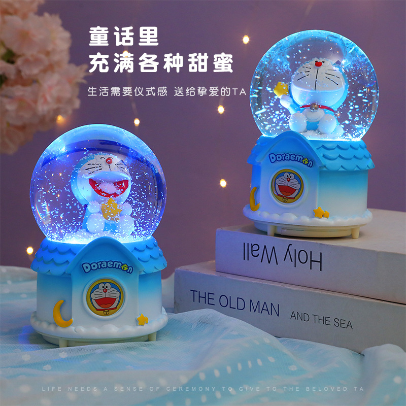 Nueva bola de cristal Doraemon Jingdang gato caja de música automática nieve azul claro grasa regalo de vacaciones