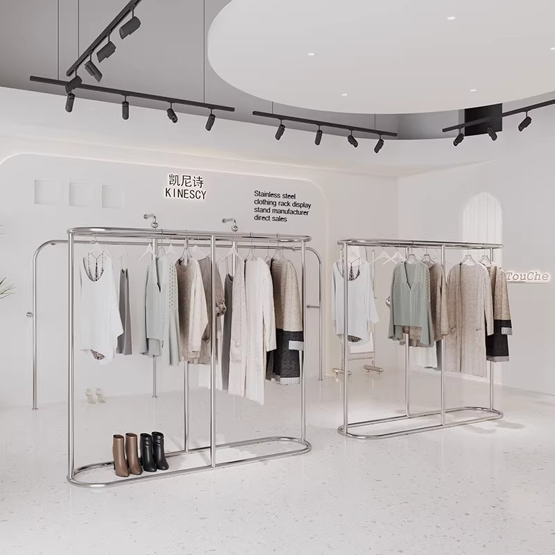 Estantes de exhibición de ropa tienda de ropa en línea estantes de ropa de acero inoxidable móviles tipo piso estante de exhibición de ropa de isla media image 3
