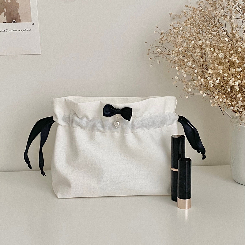 新款公主风白色化妆包韩版简约旅游护肤品收纳包蝴蝶结抽绳手提包