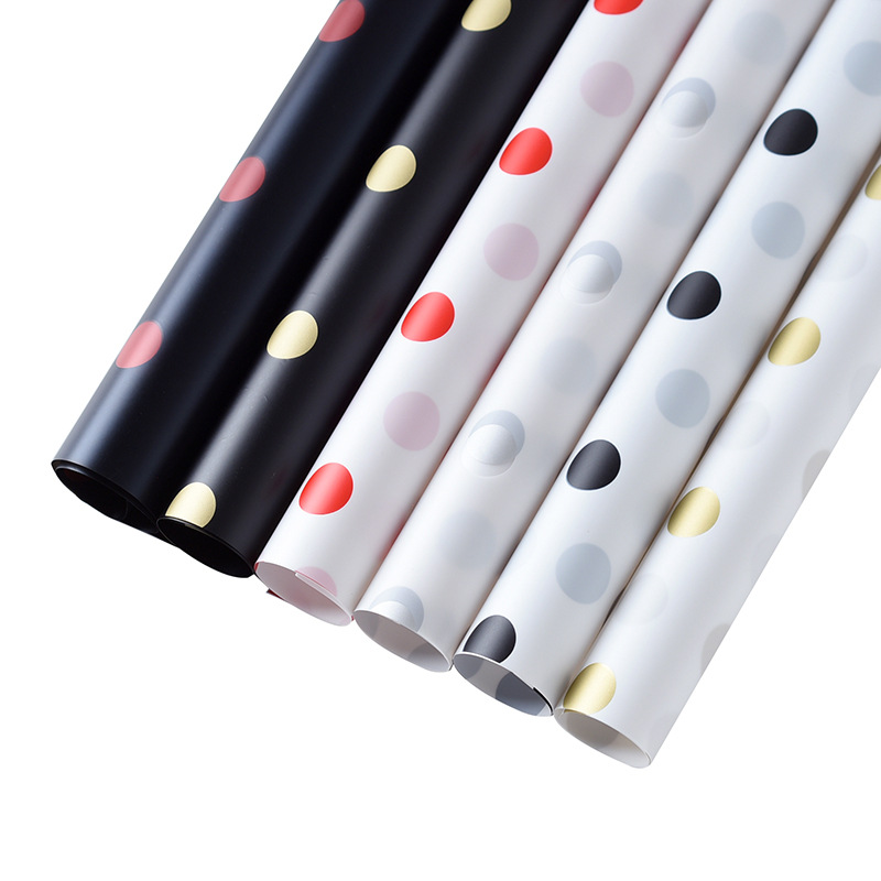 Oferta especial Papel Luoshang Papel de marco fotográfico con memoria Película de caramelo Serie de esmalte de punto de onda Papel de embalaje de flores Papel impermeable no tejido