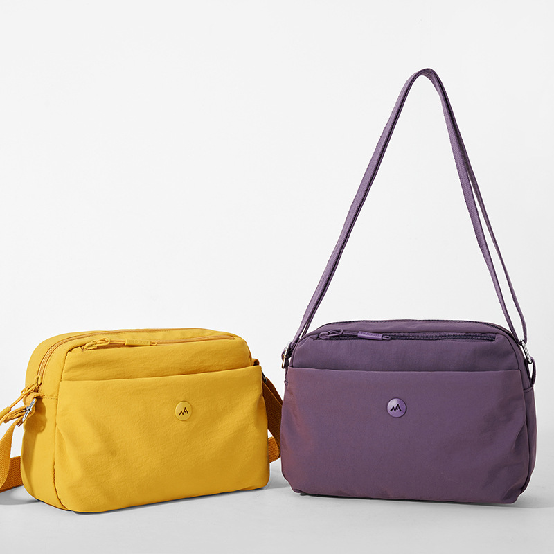 2026 primavera nueva simple bolso de tela de nylon versátil bolso de mochila de comercio exterior transfronterizo bolso de hombro de mujer ligero multicapa