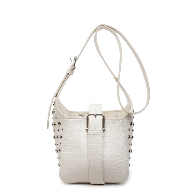 Bolso de cubo de todo fósforo transfronterizo bolso de viaje con diseño de remaches 2025 nuevo bolso de hombro de alta gama bolso de mensajero de color sólido mujer