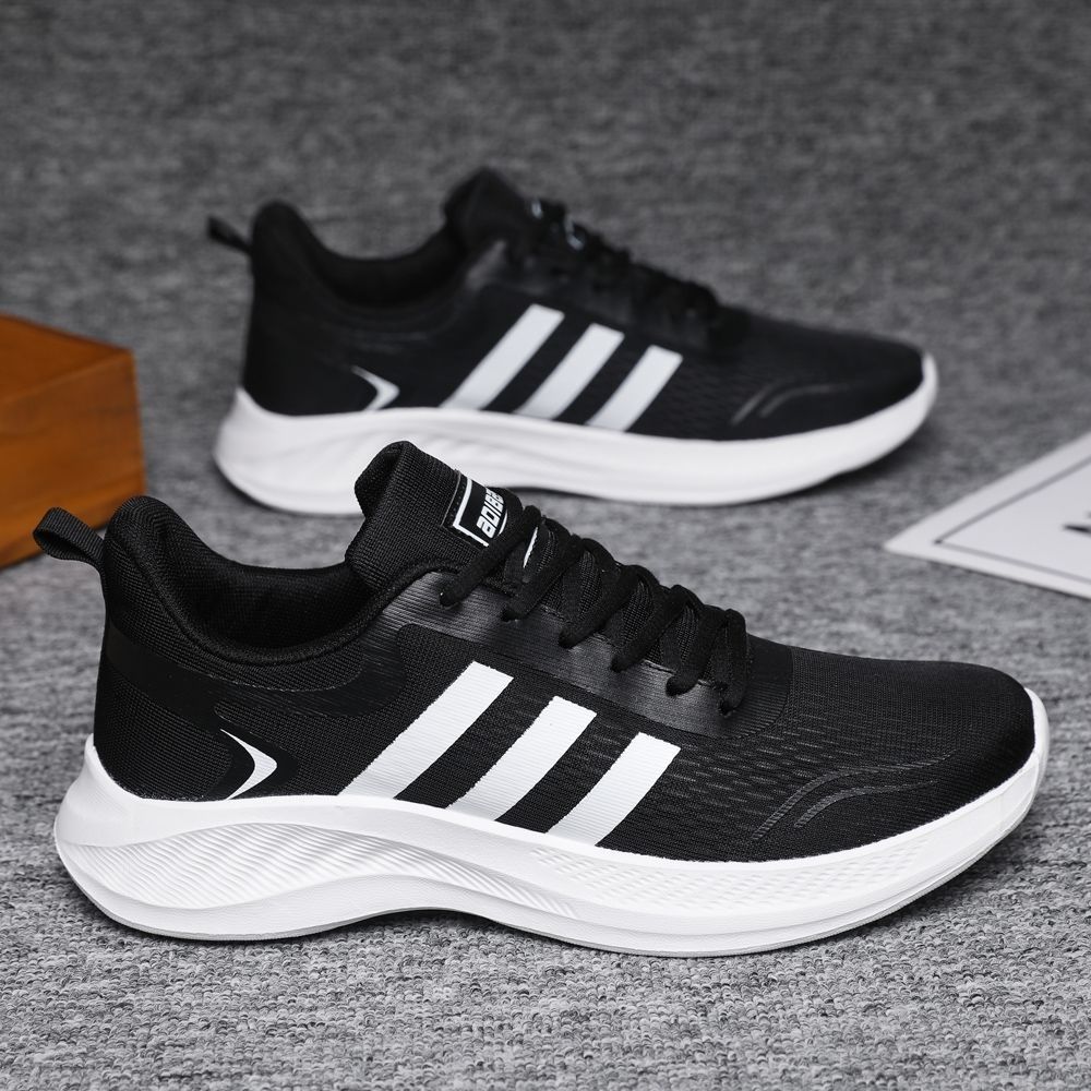 Verano nuevo estilo zapatos deportivos de talla grande estilo pareja superficie de malla de alambre de pescado pies ultraligeros y no cansados zapatos casuales de hombre para correr de todo fósforo