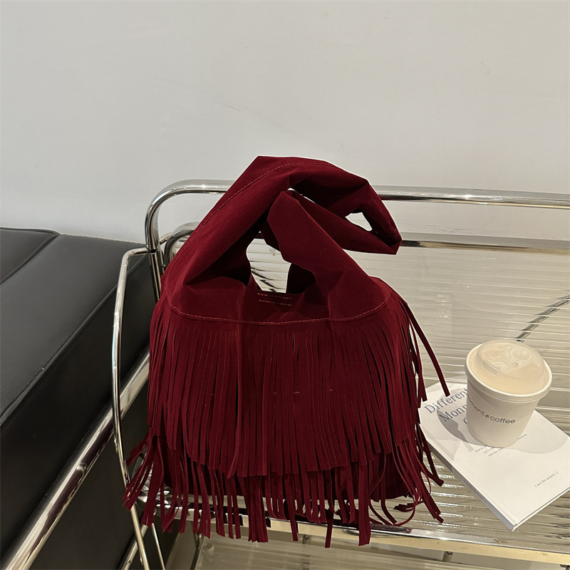 2025 primavera nueva moda texturas retro simple gran capacidad relajada humedad bolso de hombro de mujer