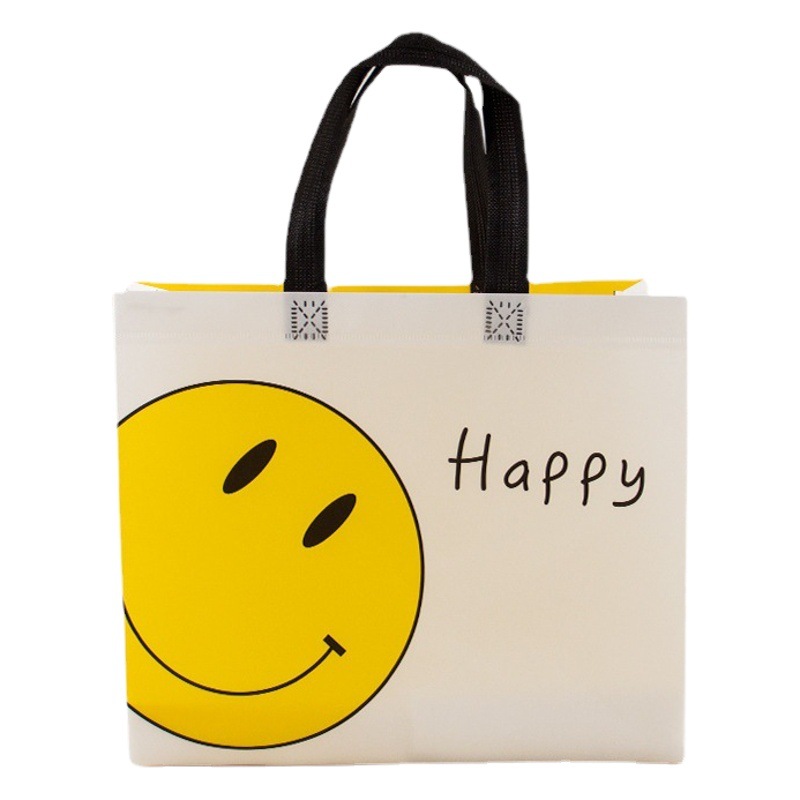 Nueva tela no tejida recubierta engrosada linda cara sonriente amarilla ropa de mujer para niños compras portátiles tienda de ropa Orden de bolsa