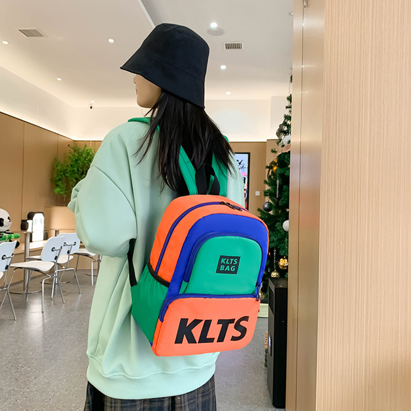 日系兒童書包2024新款韓國版字母雙肩包輕便撞色中大童書包出遊包