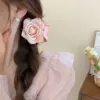 Perfume contains rose, fuchsia crab pin
