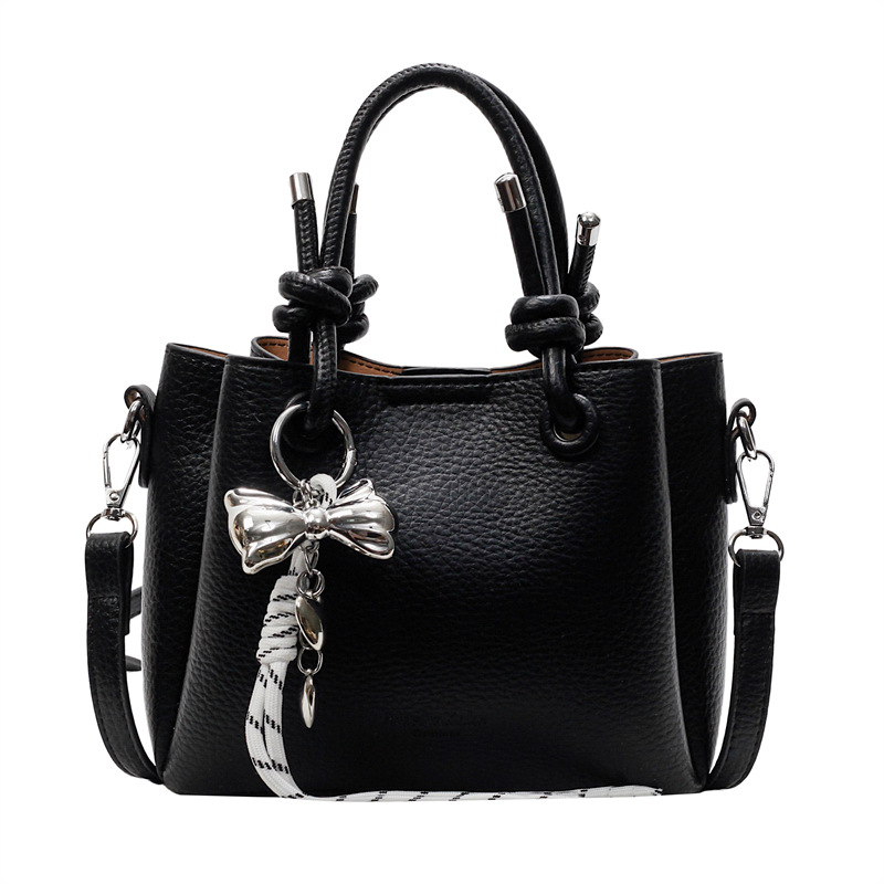 Bolso de mano de estilo explosivo de comercio exterior para mujer 2025 nuevo bolso de hombro casual simple bolso de cubo de sentido avanzado de moda salvaje