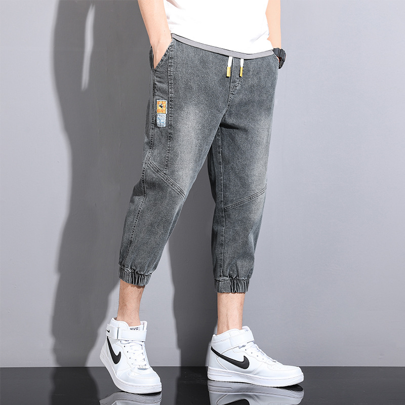 Comercio exterior cortar la etiqueta ropa de hombre suelta pie abrazado siete puntos jeans cintura elástica cuerda de dibujo de verano juvenil ocio pantalones harun moda