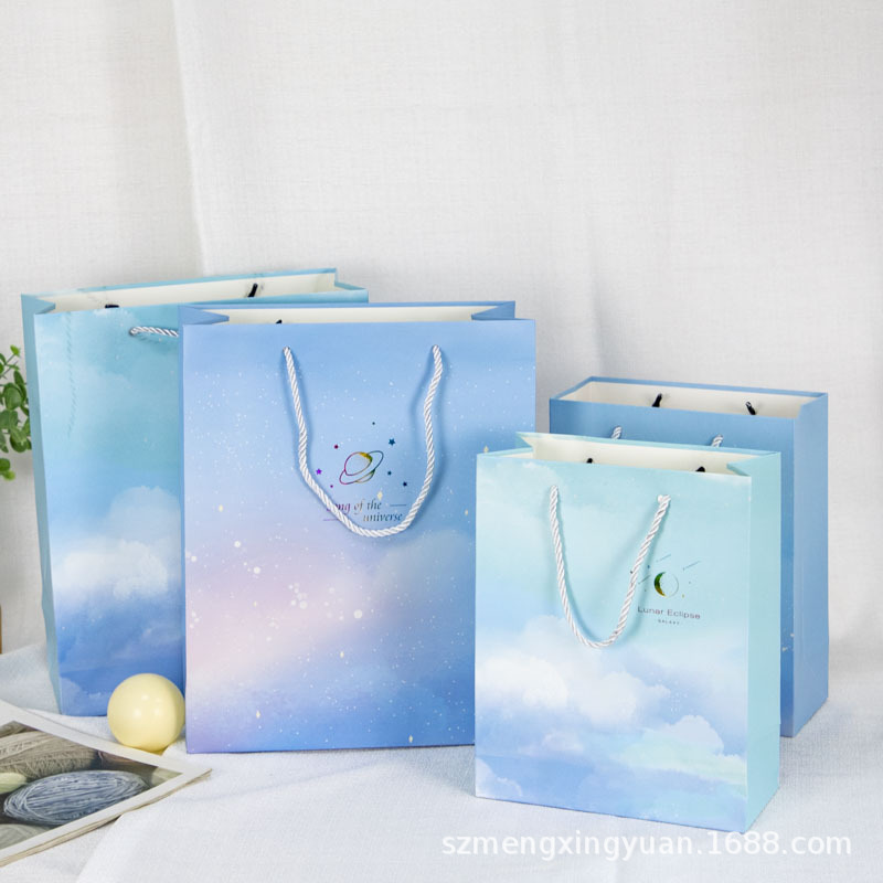 Creativo simple regalo de la mano bolsa de regalo de boda ins estilo cielo estrellado caja de regalo bolsa de papel portátil de protección del medio ambiente