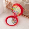 Folding mirror comb (big red needle)