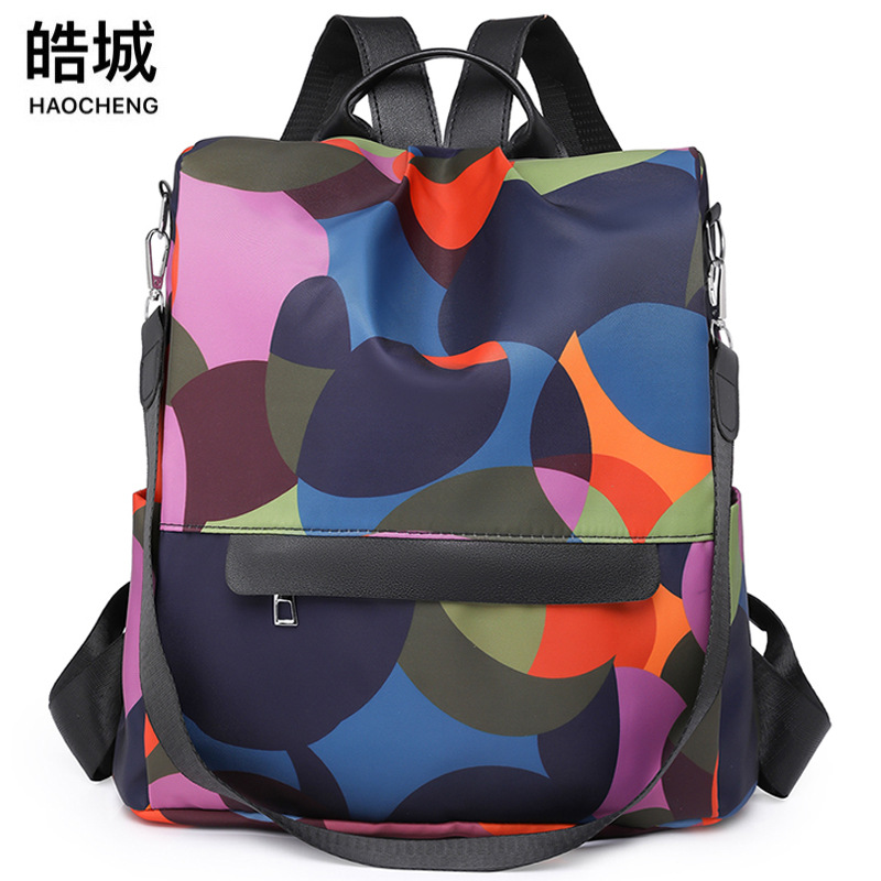 Comercio exterior al por mayor 2023 nueva mochila antirrobo de nailon para mujer casual moda contraste color mochila de viaje de doble uso marea
