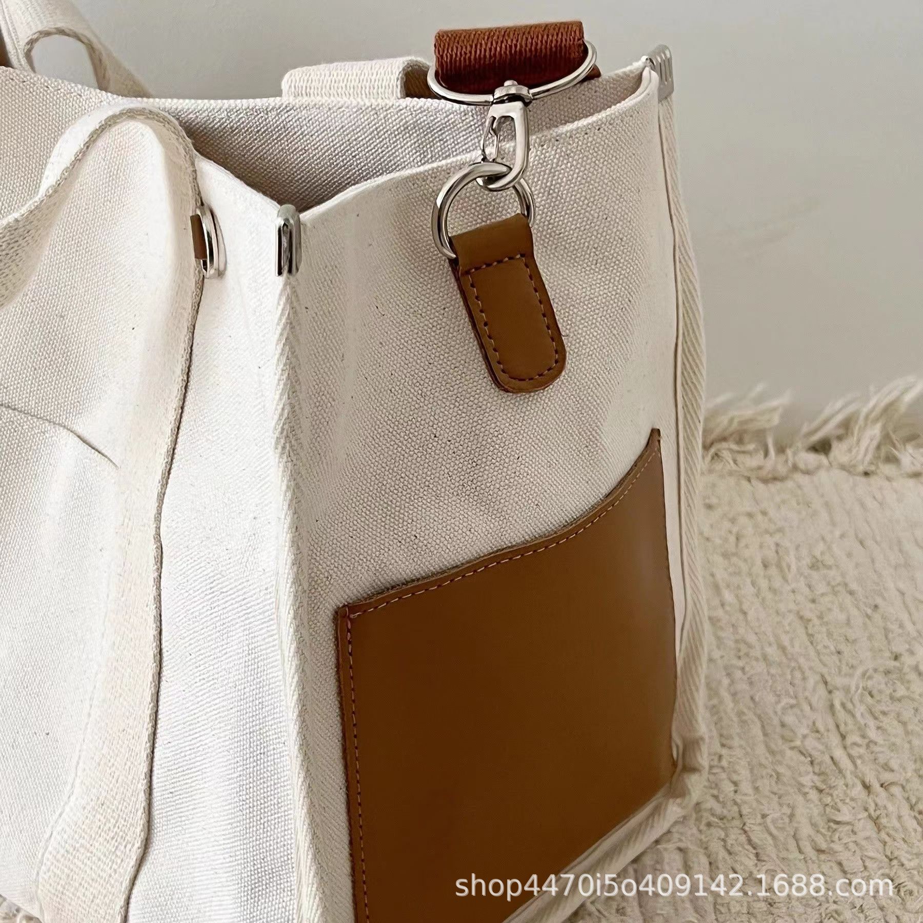 Bolsa coreana de gran capacidad simple para mamás, bolso de hombro portátil, bolso impermeable, pañales de lona, bolso para madre y bebé.