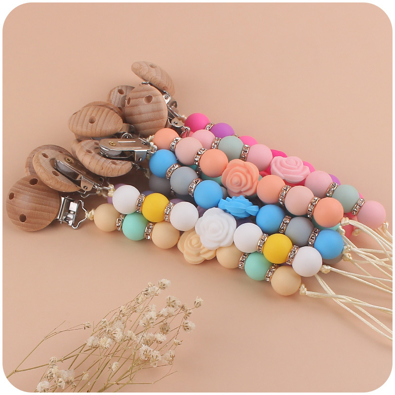 Nuevo bebé de dibujos animados de doble cara Rosa mordedor creativo DIY flash cuentas de ladrillo silicona mordedura pezón cadena anti-caída