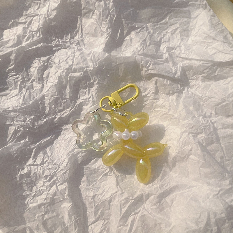 Pequeño Libro Rojo mismo lindo jalea globo láser perro llavero colgante colorido cachorro de dibujos animados teléfono llavero