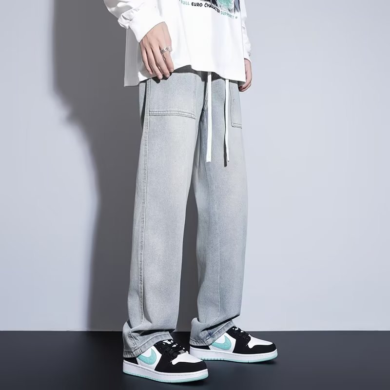 Pantalones casuales de primavera y otoño para hombres, estilo suelto de Hong Kong, sarga, pantalones de trapeador de pierna ancha de arte de moda, jeans deportivos