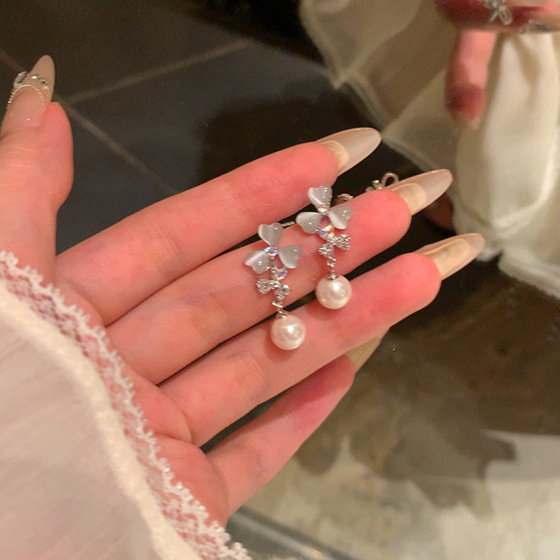 Pendientes de perlas de flor de circón de aguja de plata, pendientes de lujo de alta gama de lujo ligero exquisito, pendientes de todo fósforo blanco de moda de nicho al por mayor