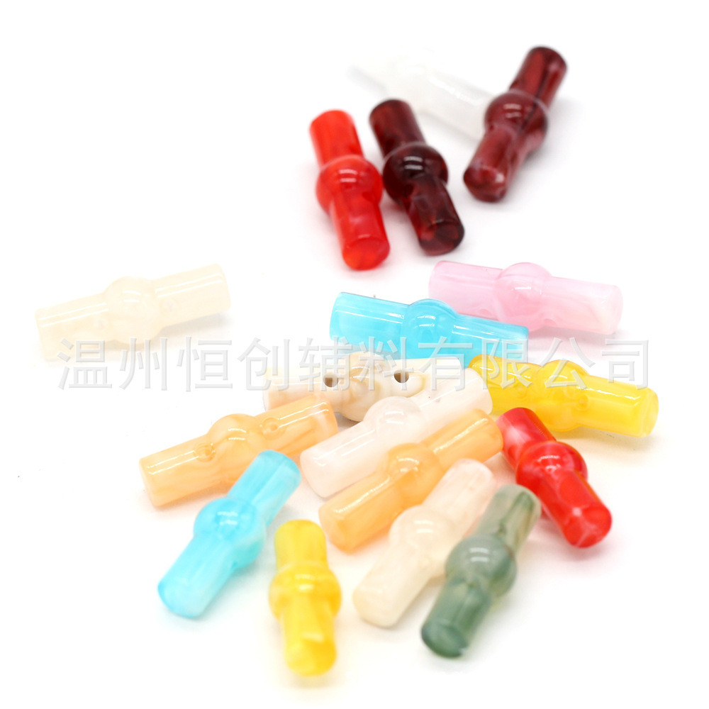 25x9mm brillante Hengchuang botón de resina cilíndrica de dos agujeros botón de estilo nacional suéter de punto botón de color de bricolaje al por mayor