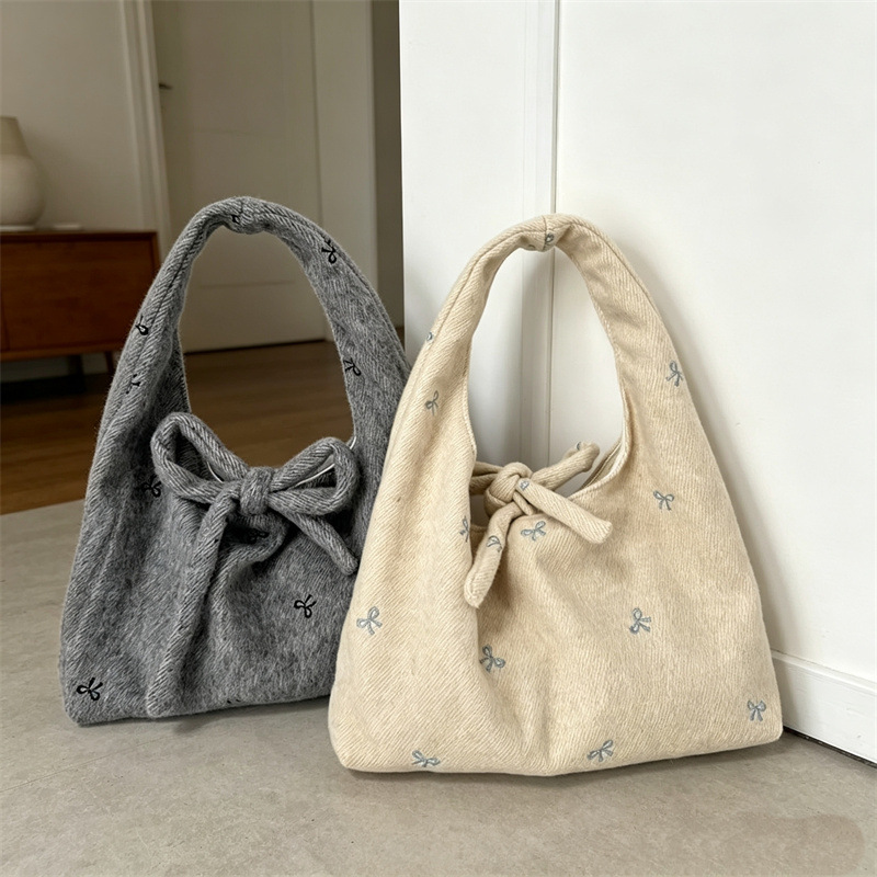 New bow-knot embroidered handbag, niche design, canvas tote bag for women, versatile and stylish for commuting New bow-knot embroidered handbag, niche design, canvas tote bag for women, versatile and stylish for commuting