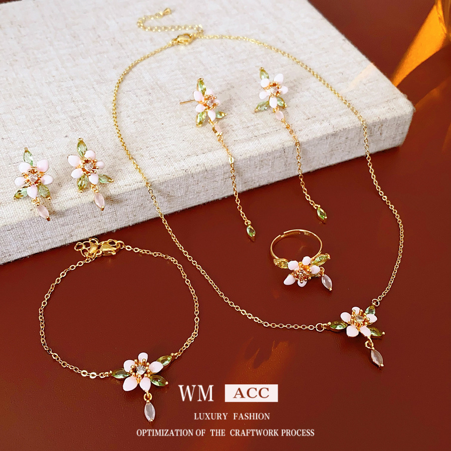 Juego de flores de goteo de aguja de plata de galvanoplastia de oro real, anillo de pulsera de estilo de esmalte retro, collar de lujo ligero, pendientes de sentido avanzado