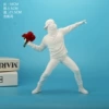Banker throwing a flower boy-white