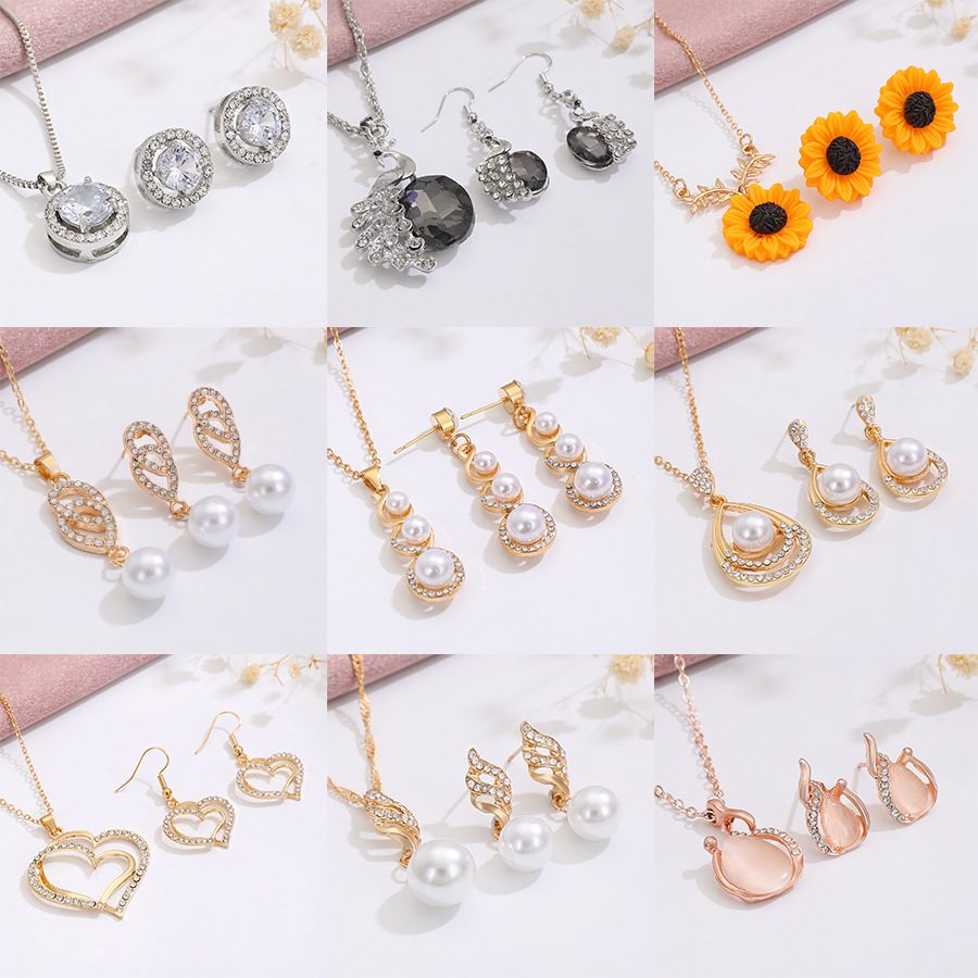 Traje de joyería de perlas de diamantes de Venta caliente transfronteriza temperamento de moda de mujer flor geométrica gota de agua collar pendientes traje