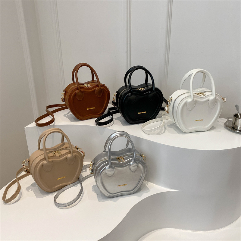 Bolso de mujer 2024 verano nuevo bolso de moda empujada textura PU bolso de hombro simple color sólido mochila de viaje